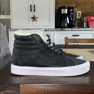 Black and white fur Vans